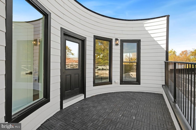 entrance to property featuring a balcony