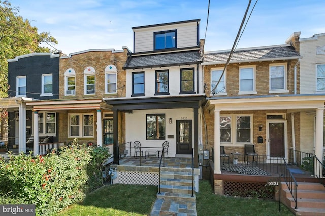 townhome / multi-family property with covered porch