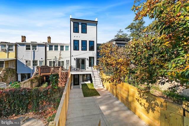 rear view of property with a deck