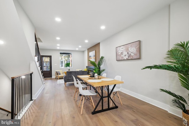 dining area featuring light wood-type flooring