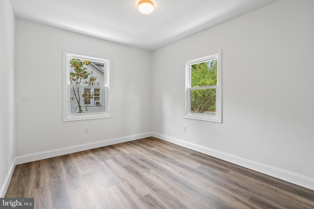 empty room with light hardwood / wood-style floors