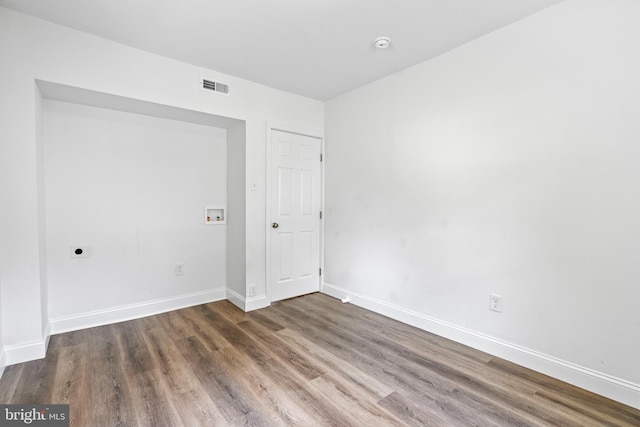 spare room with hardwood / wood-style floors