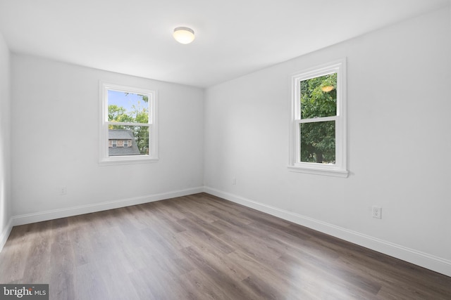 unfurnished room with light hardwood / wood-style flooring