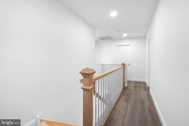 hall with dark hardwood / wood-style floors