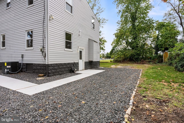 view of home's exterior with central AC