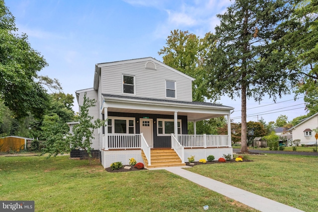 view of front of house featuring a front yard and a porch