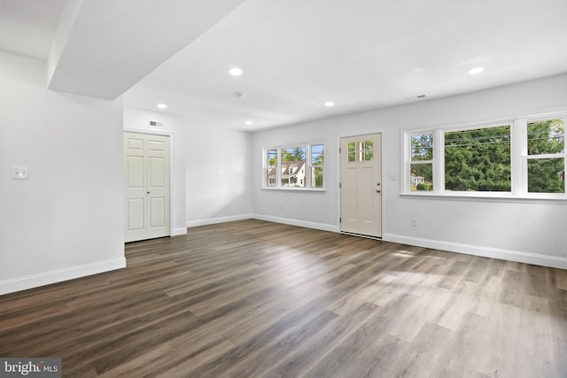 unfurnished living room featuring hardwood / wood-style floors