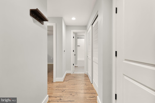 corridor featuring light hardwood / wood-style floors