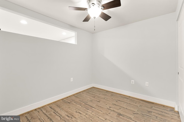 spare room with light hardwood / wood-style floors and ceiling fan