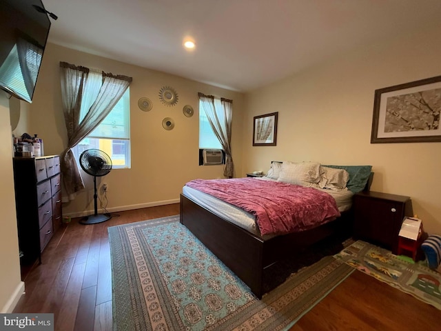 bedroom with hardwood / wood-style flooring and cooling unit