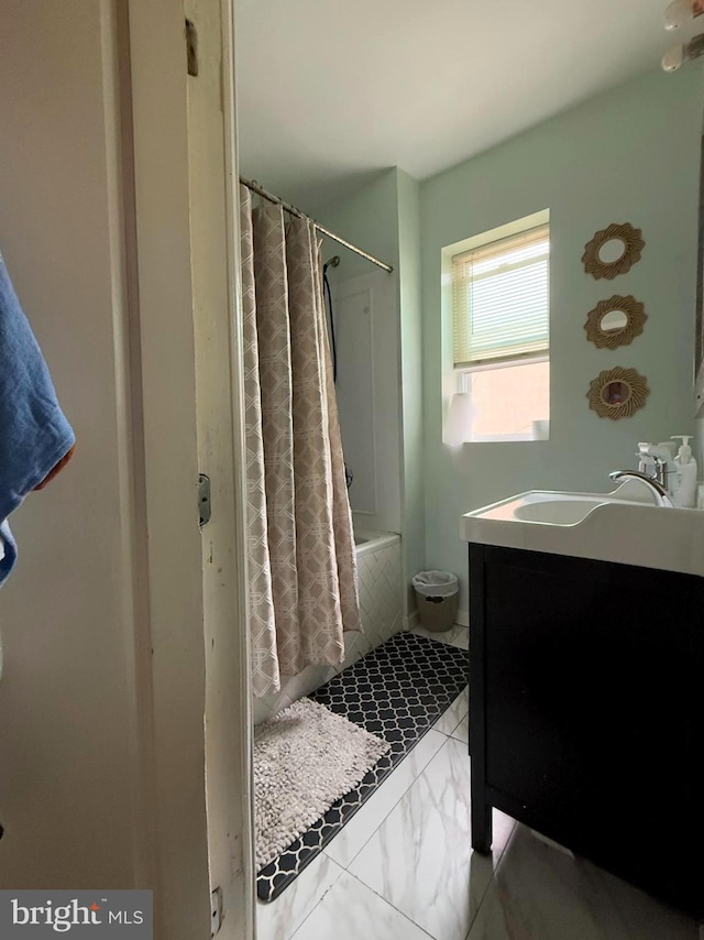 bathroom with vanity and shower / tub combo