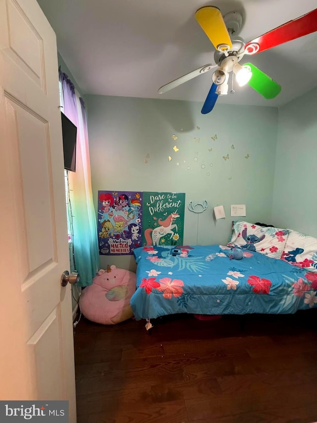 bedroom featuring dark hardwood / wood-style floors and ceiling fan