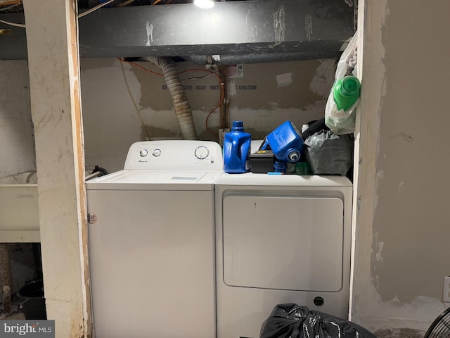 laundry area with washing machine and clothes dryer