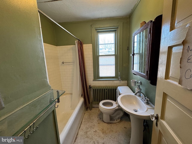 full bathroom featuring radiator, shower / tub combo with curtain, a textured ceiling, tile patterned flooring, and sink