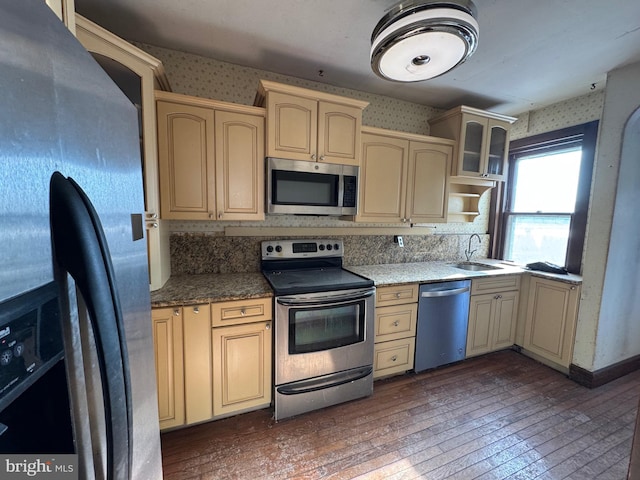 kitchen with dark wood-type flooring, sink, light brown cabinetry, and appliances with stainless steel finishes