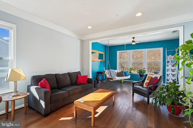 living room featuring ornamental molding, ceiling fan, and dark hardwood / wood-style flooring