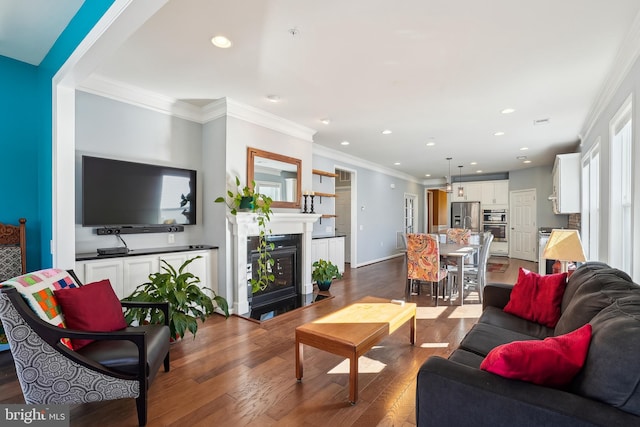 living room with crown molding and dark hardwood / wood-style floors