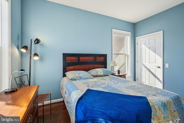 bedroom featuring dark wood-type flooring