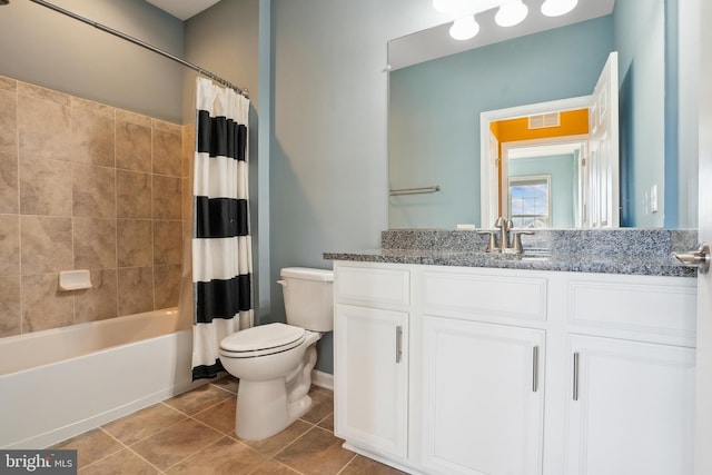 full bathroom featuring shower / tub combo, vanity, toilet, and tile patterned flooring