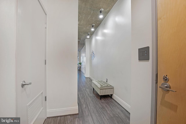 hall with dark hardwood / wood-style flooring