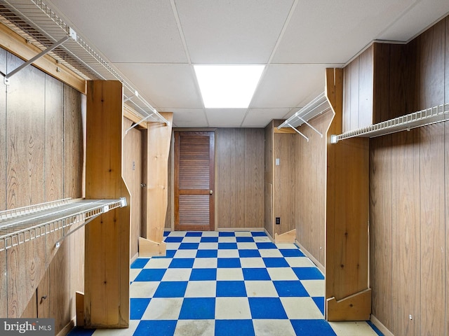 spacious closet with a drop ceiling