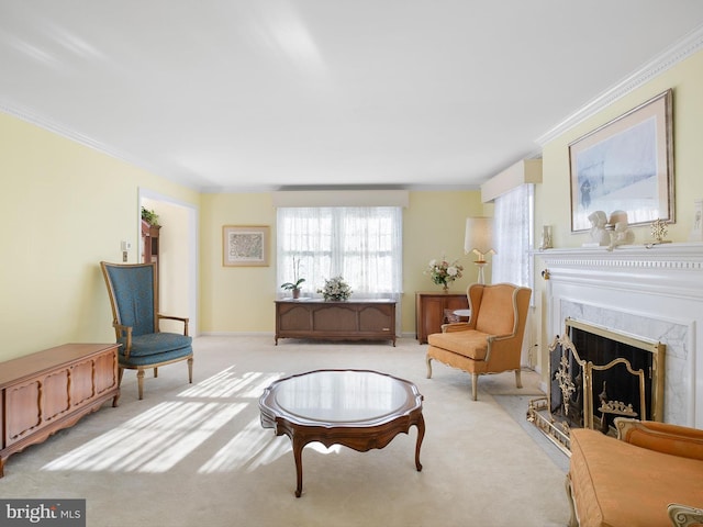 sitting room featuring ornamental molding, light colored carpet, and a premium fireplace