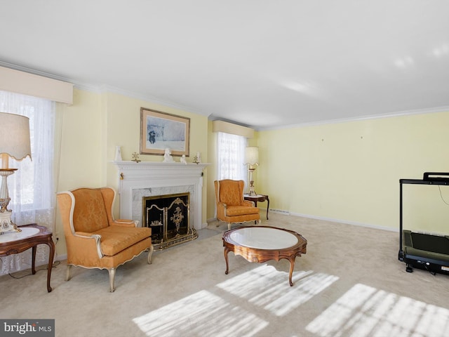 sitting room with light colored carpet, ornamental molding, and a fireplace