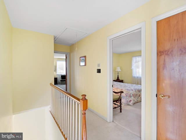 hallway featuring light carpet