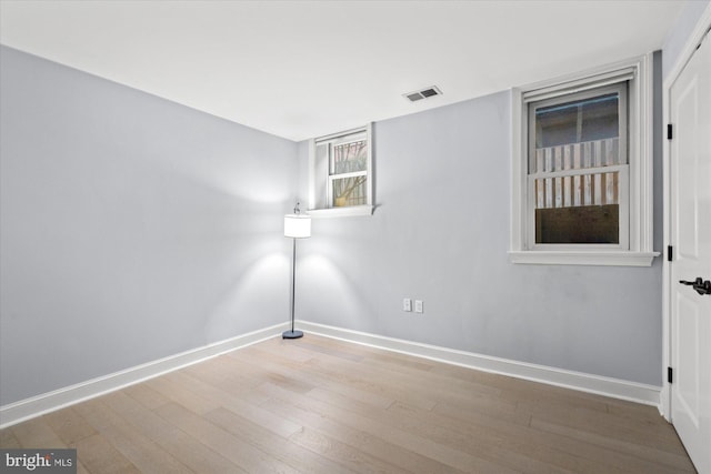 spare room featuring light wood-type flooring