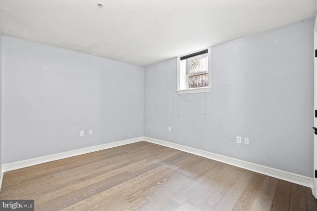 unfurnished room featuring hardwood / wood-style floors