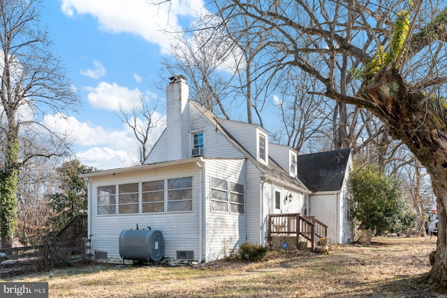 view of side of property with a sunroom