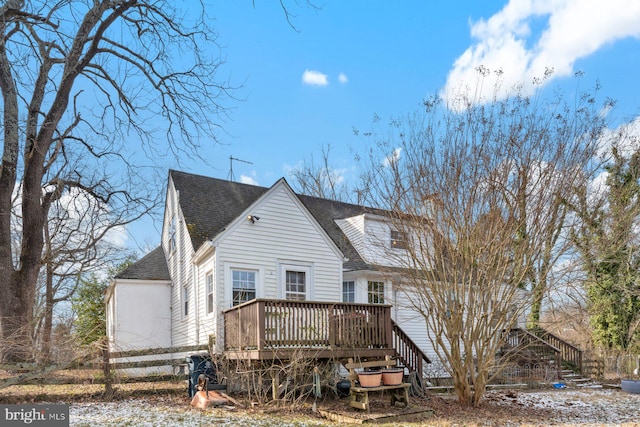 back of house featuring a deck