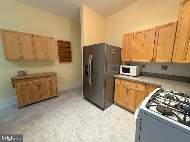 kitchen featuring white appliances and decorative backsplash