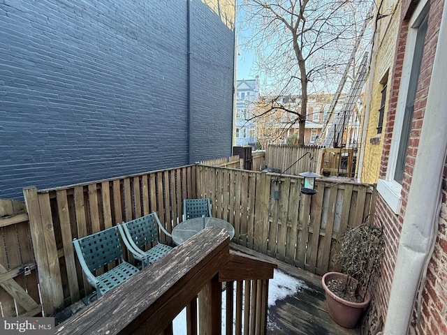 wooden balcony featuring a deck