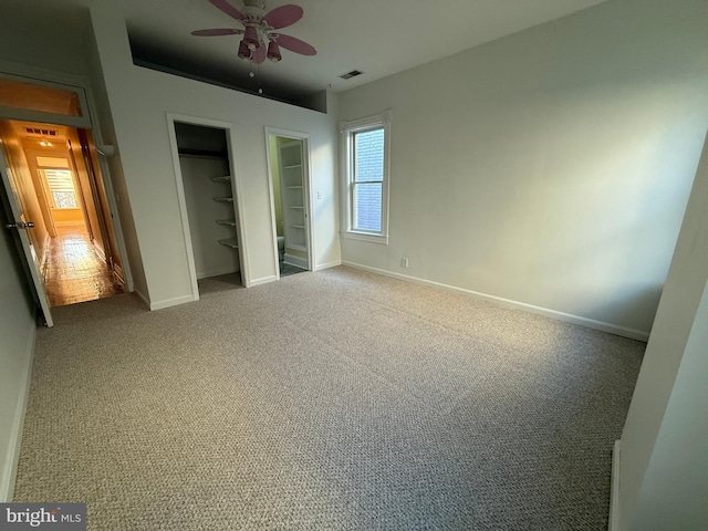 unfurnished bedroom with a closet, ceiling fan, and carpet