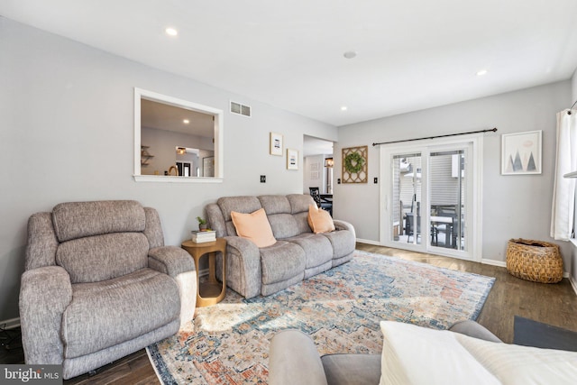 living room featuring dark wood-type flooring