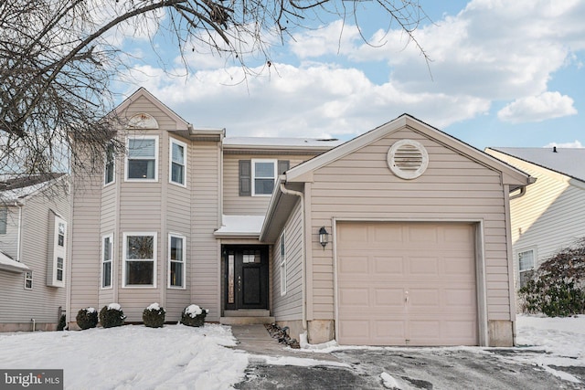 view of front of property featuring a garage