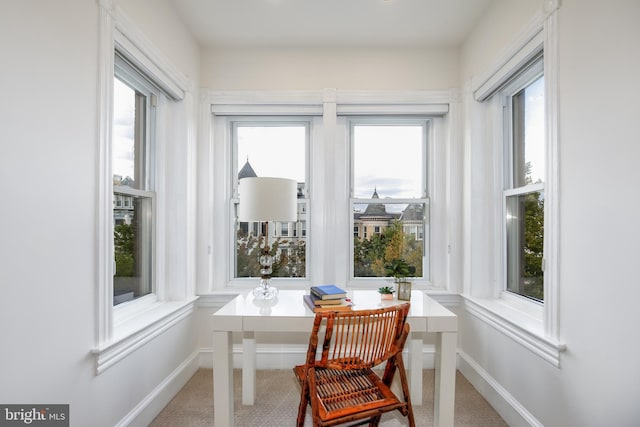 sunroom / solarium featuring plenty of natural light