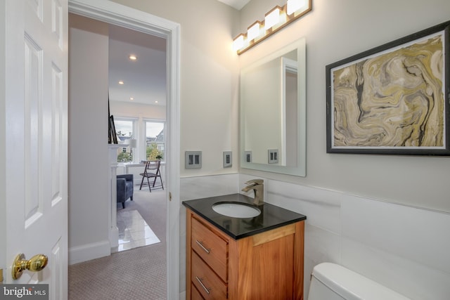 bathroom featuring vanity and toilet