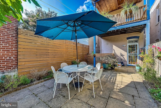 view of patio / terrace with a balcony