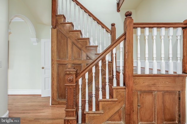 staircase featuring wood-type flooring