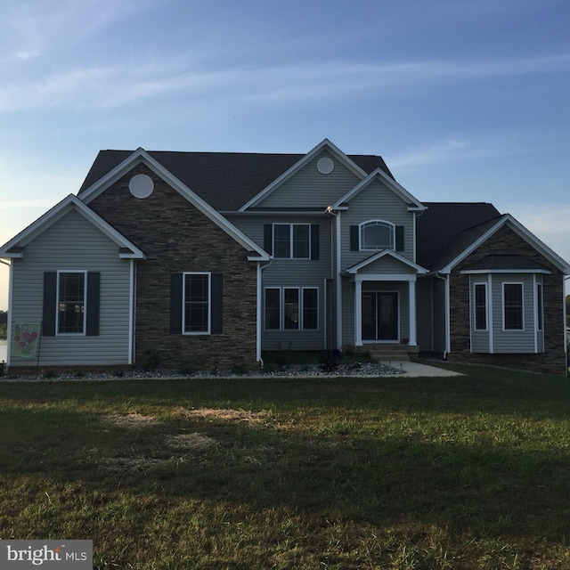 front facade with a front lawn