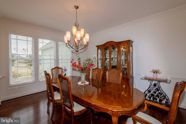 dining space with crown molding, an inviting chandelier, and dark hardwood / wood-style flooring