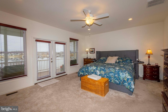 carpeted bedroom featuring access to exterior, ceiling fan, and french doors