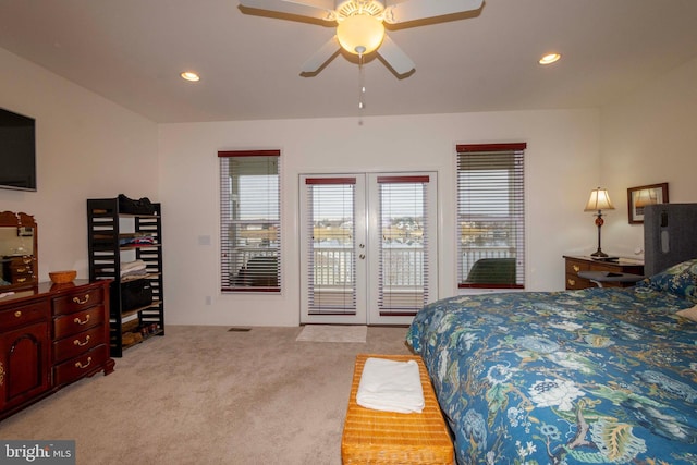 bedroom with french doors, light colored carpet, ceiling fan, and access to outside