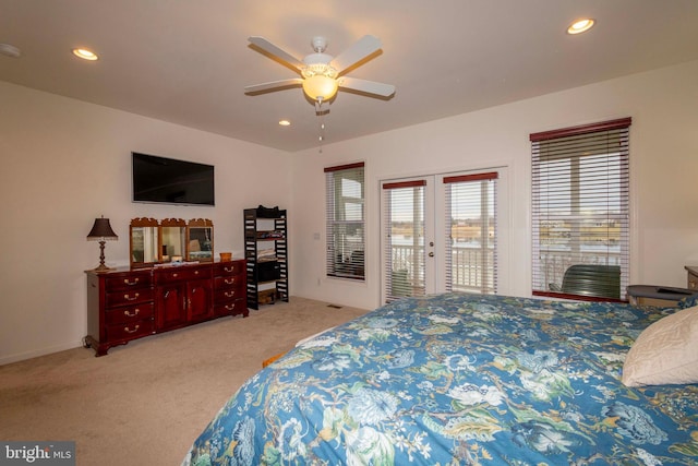 carpeted bedroom with access to outside, ceiling fan, and french doors