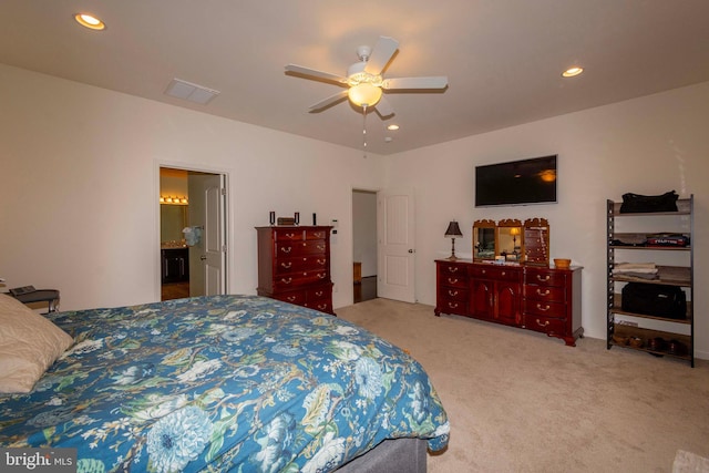 bedroom with ceiling fan and light carpet