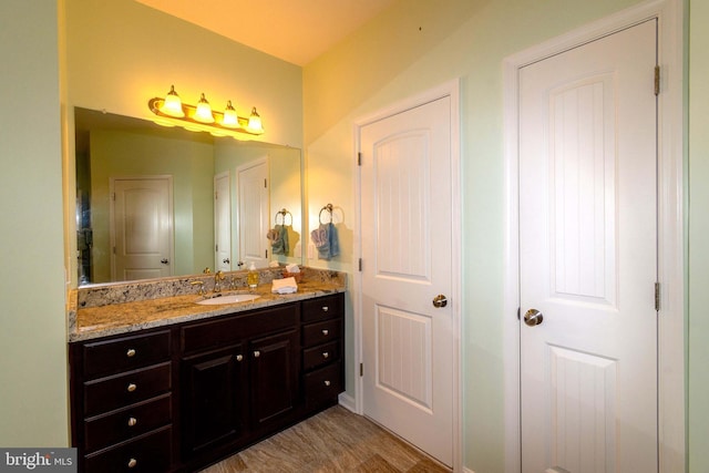 bathroom with vanity and hardwood / wood-style flooring