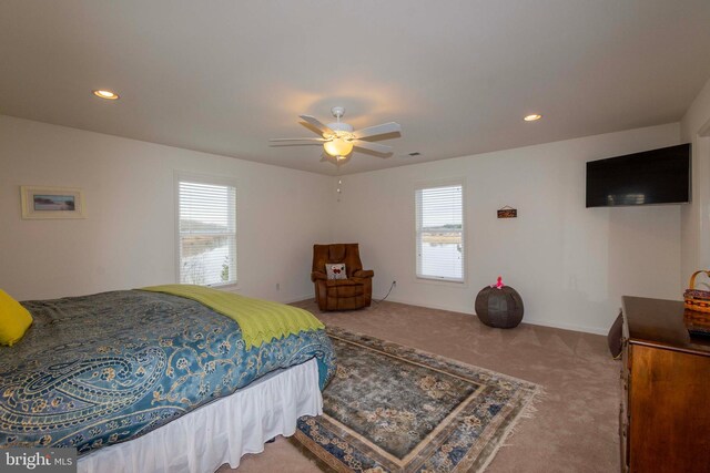 carpeted bedroom with ceiling fan