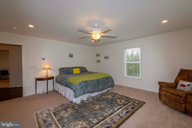 bedroom with ceiling fan and carpet floors